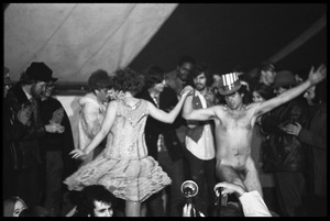 Yippies on stage at the Counter-inaugural Ball, 1969: naked man in an Uncle Sam hat dances with a woman in a flapper outfit
