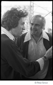 Bill Graham (left) talking to Marlon Brando