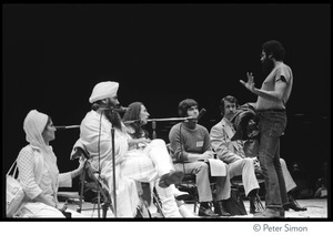 Yogi Bhajan (second from left) on stage on the last night of the Kohoutek Celebration of Consciousness