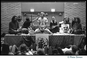 Ram Dass and associates on stage during an appearance at the College of Marin