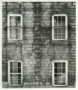 Slate siding and four windows