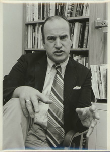 David A. Booth sitting indoors