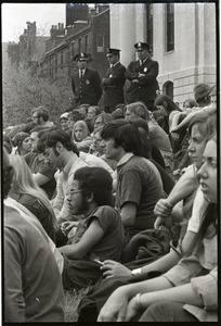 Demonstration at State House against the killings at Kent State: crowd seated on the State House steps, police behind