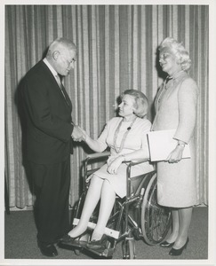 Margaret Milbank Bogert with an unidentified man and a woman seated in a wheelchair