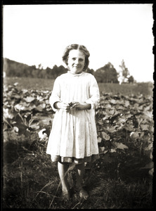 Barefoot girl standing in field (Greenwich, Mass.)