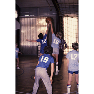 Boys playing basketball