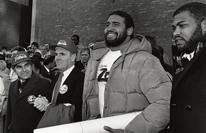 Mayor Raymond L. Flynn and Governor Michael Dukakis with New England Patriots players Brian Holloway and Kenneth Sims, Head Coach Ray Berry and others at celebration for New England Patriots 1985 team