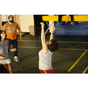 Woman reaching her arms up during a game of volleyball