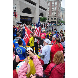 Chinese and American flags amongst crowd at One Run finish line