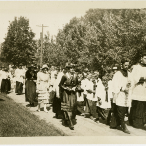 Priest Leads Long Procession