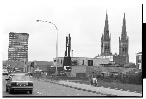 St. Peter's, Falls Road, Belfast. The shot shows the twin spires of St. Peter's Cathedral and a block of flats