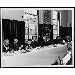 Officers and guests eat and converse at the head table during a Boys' Clubs of Boston awards event