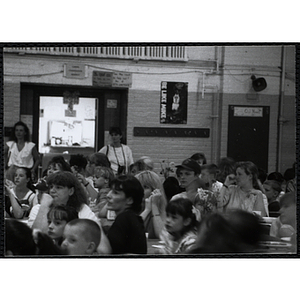 Guests, seated in an auditorium, look to the front at a Kiwanis Awards Night