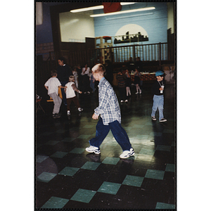 A Boy walking across the room during an open house
