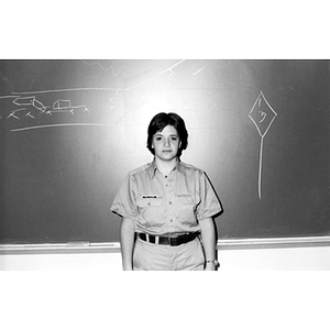 A woman stands in front of a chalk board during Criminal Justice Training