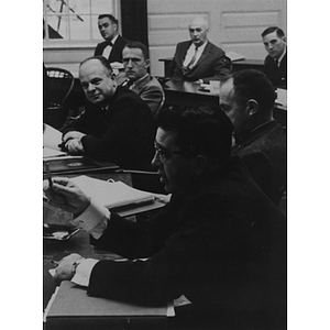 Faculty and administration seated at table