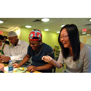 Qinrui Pang and Ulysses Ifill laugh when the Torch Scholars visit the Exhibition Kitchen