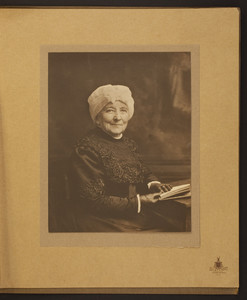 Half-length portrait of Mary Perkins Olmsted, seated, facing front, holding a book, undated
