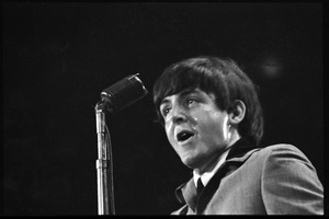 Paul McCartney at the microphone, in concert with the Beatles, Washington Coliseum