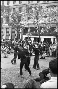 Street theater at the Vietnam Moratorium in New York: mimes in a gun fight