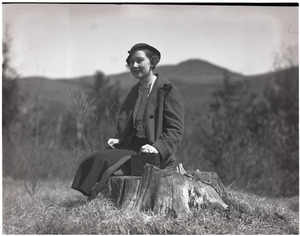 Blanche Dreier, seated on a rock