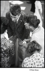 Robert Kennedy and Kenneth Keating campaigning in Riverdale: man in checkered suit speaking with Andrea Simon (r) and two unidentified women