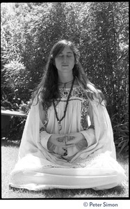 Dolma: full-length portrait, seated in lotus position, meditating, with bhairava mudra