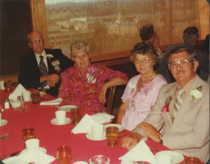 Charles Clagg and Earl Williams with their wives at reunion dinner