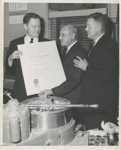 William C. Gorthy and an unidentified man present the thumbs up award