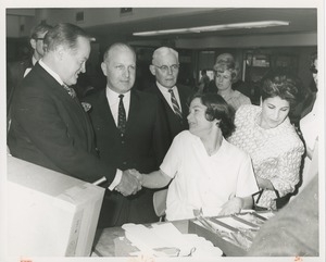 Man shaking hands with female ICD client in workshop