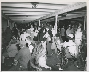 Dancing and sitting in interior of the boat