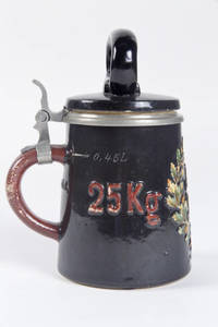 A character pottery stein resembling a dumbell