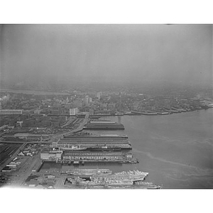 South Boston Harbor area and docks, United States Navy ships, front, then Fish Pier and Commonwealth Pier, Boston, MA