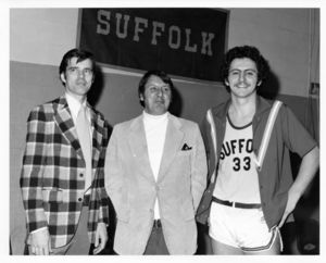 Suffolk University men's basketball player Chris Tsiotos (right) with Coach James Nelson (left) and team captain Don Woodrow ) at game versus Connecticut College, circa 1978-1979