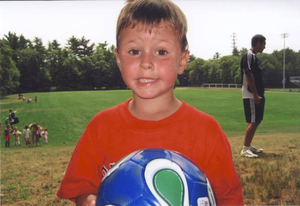 Jack Demong playing soccer at camp at Norwell High School