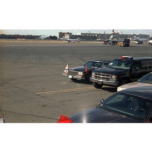 Limousine and security vehicle await the arrival of Chinese Premier Zhu Rongji at Boston Logan Airport