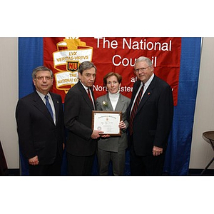 New inductee Mary Ryan poses with her certificate and others at The National Council Dinner