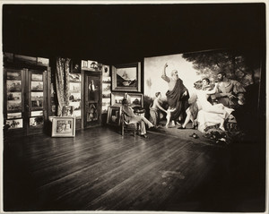Portrait of Ernest Wadsworth Longfellow, sitting in a chair, facing right, looking at a painting in his studio, Ernest Longfellow House, Coolidge's Point, Manchester, Mass., undated