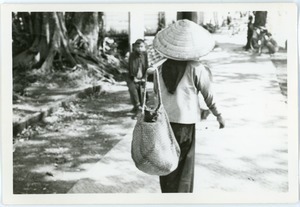 Sidewalk scene with woman, in French Quarter