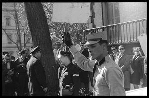 American Nazi Party counter-protester, Douglas L. Niles, in uniform, carrying a sign: Washington Vietnam March for Peace