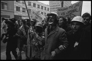 Anti-Vietnam War marchers wearing helmets during the Counter-inaugural demonstrations, 1969
