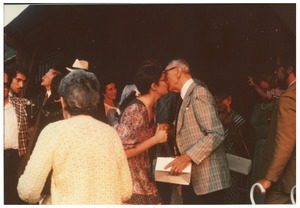 Lisa Lipshires kissing David Lipshires at a family gathering