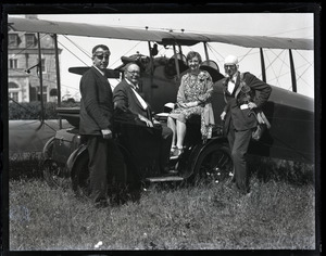 Edward Howland Robinson Green, seated with two unidentified men, a woman, and biplane