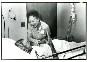 Hospital volunteer with patient