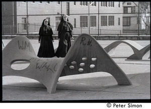 Nuns walking across a playground, on way to commemorative service for Martin Luther King