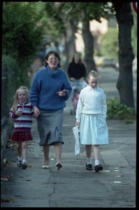 Mother and daughters walking down a Dublin street