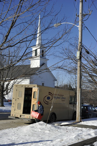 Western Massachusetts Regional Library System van delivering interlibrary loan books the New Salem Public Library, with Center Congregational Church in background