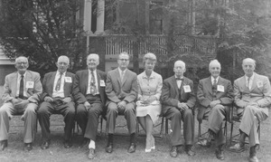 Members of the class of 1901 with John and Angie Lederle sitting in front of a house
