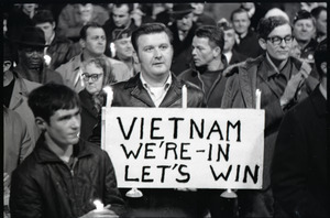 Young Americans for Freedom pro-Vietnam War demonstration, Boston Common: Man holding sign reading "Vietnam: we're in, let's win"