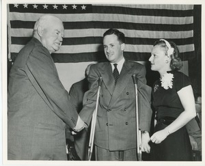 Herbert Hoover shaking hands with client and Margaret Milbank Bogert at Institute Day